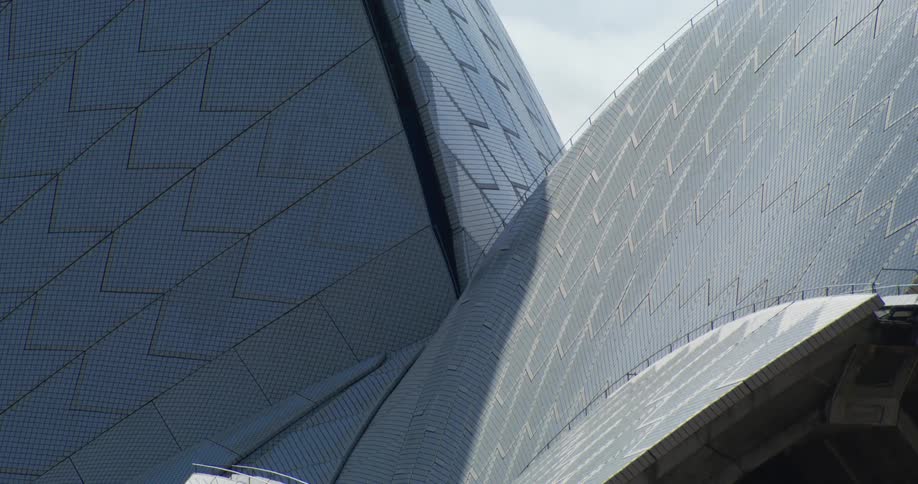 Modern exterior architecture of a building with patterns and reflections of sunlight