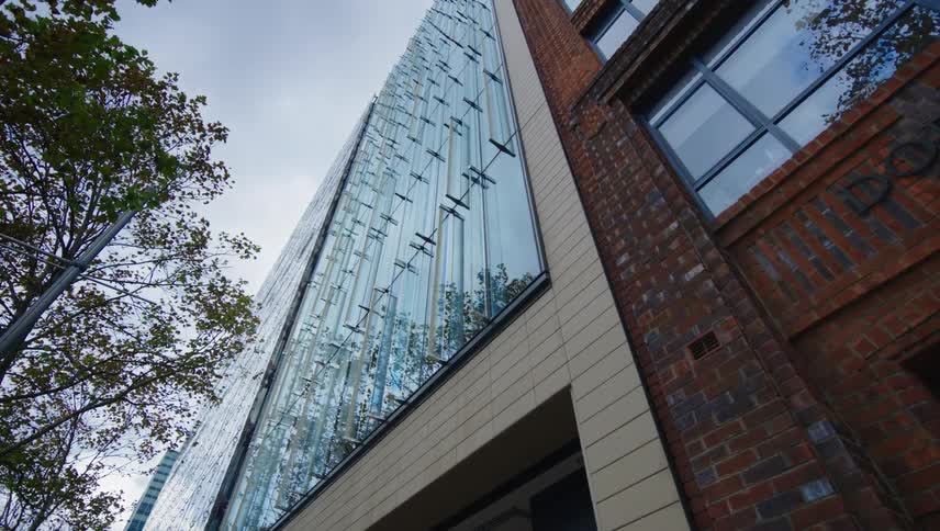 View upwards of a modern building with glass windows