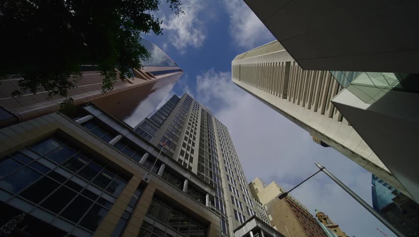 Upward view of large modern buildings in a metropolis