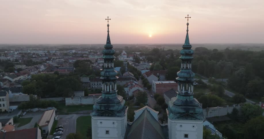 A church looms over a city and suburban area