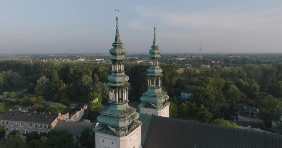 Aerial view of two towers of a church located in the center of an urban city