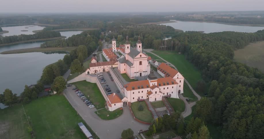 Aerial of a castle surrounded by several lakes