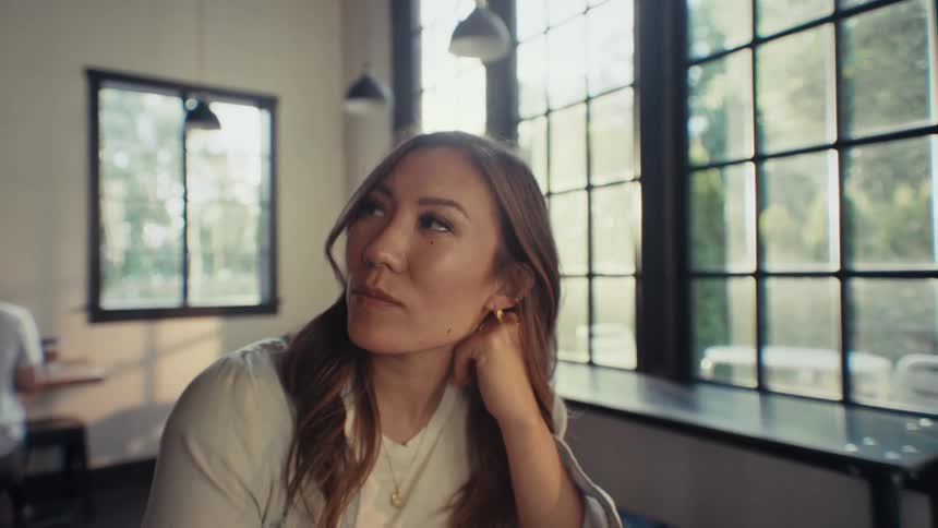Portrait of a woman sitting thoughtfully