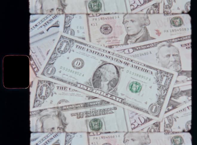 Close up of scattered dollar bills