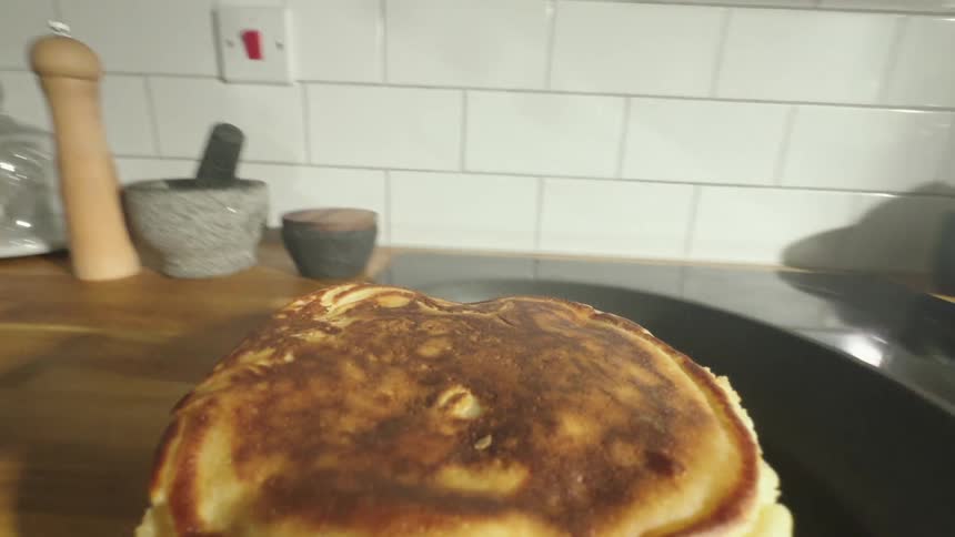Point of view of a spatula cooking a pancake