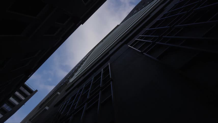 A lowangle view of a tall building with a clear sky in the background