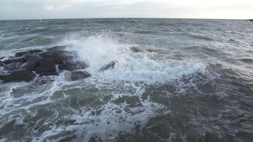 Water waves crashing on some rocks