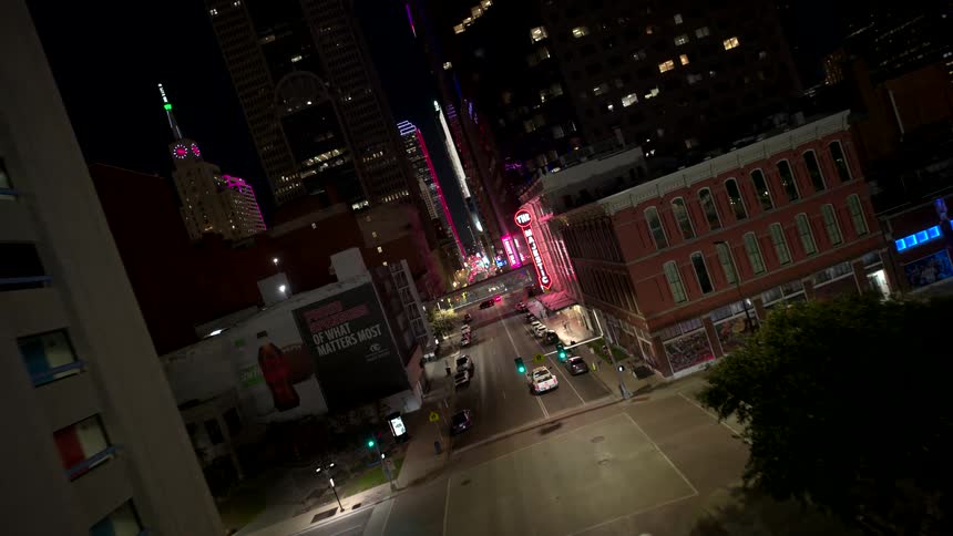 Aerial view of a street in a metropolis illuminated at night