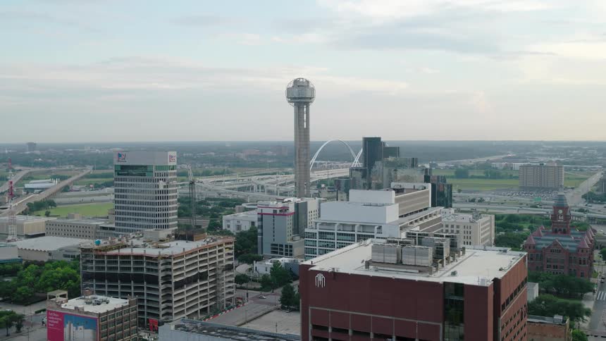 Aerial panorama of a metropolis and a tall tower in the background
