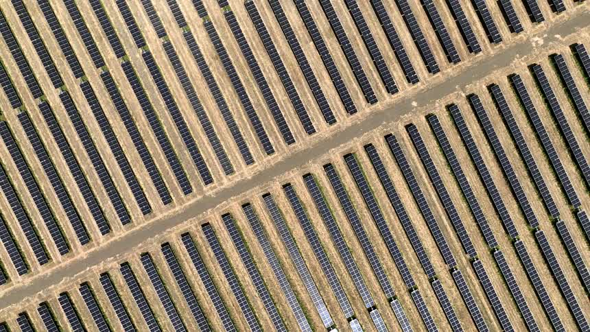 Aerial view of solar panels in a field