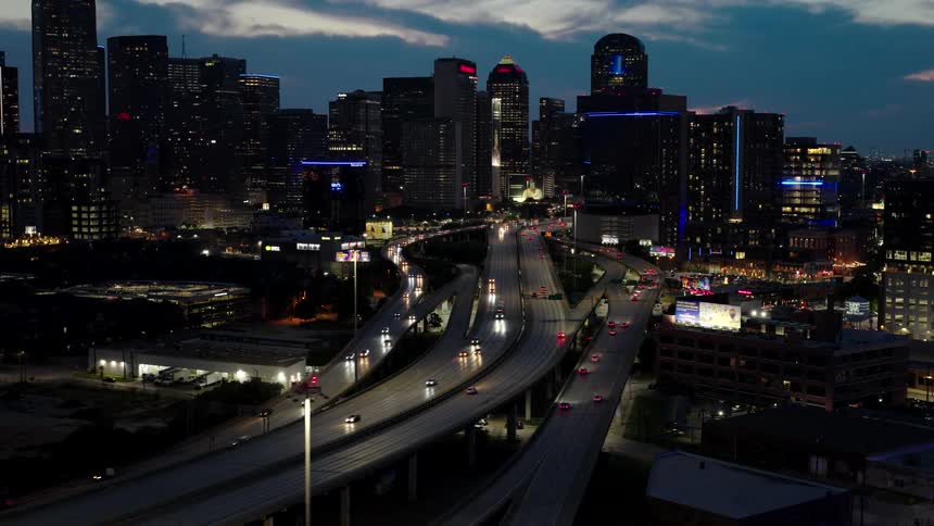 Aerial view of a highway between a metropolitan city seen at night