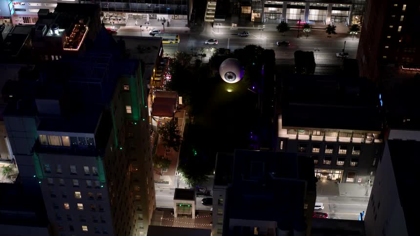 Aerial view of buildings in a metropolis seen at night