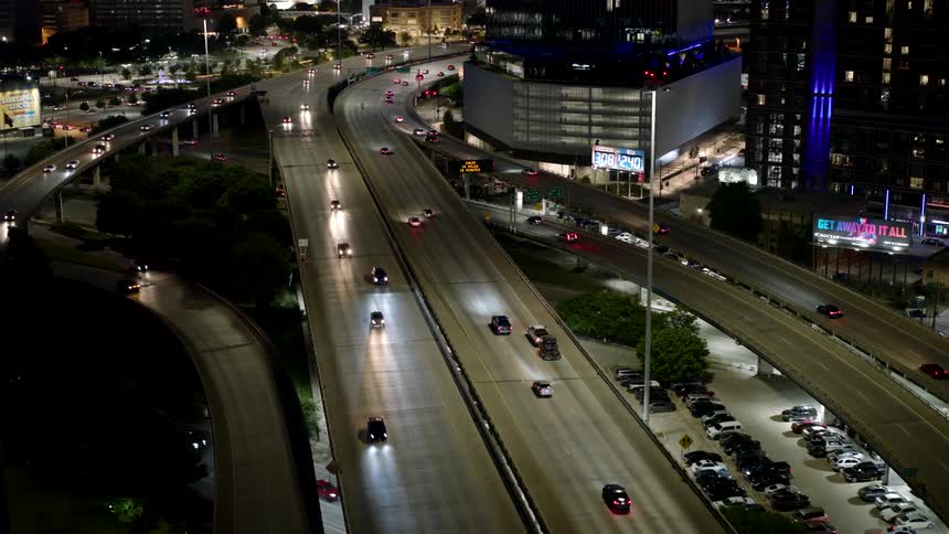 An aerial view of a busy city freeway at night
