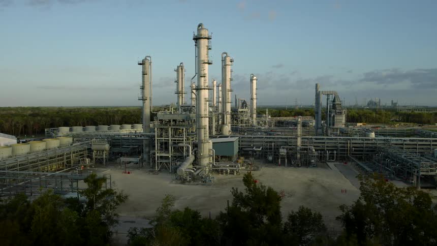 Panorama of a refinery factory surrounded by trees