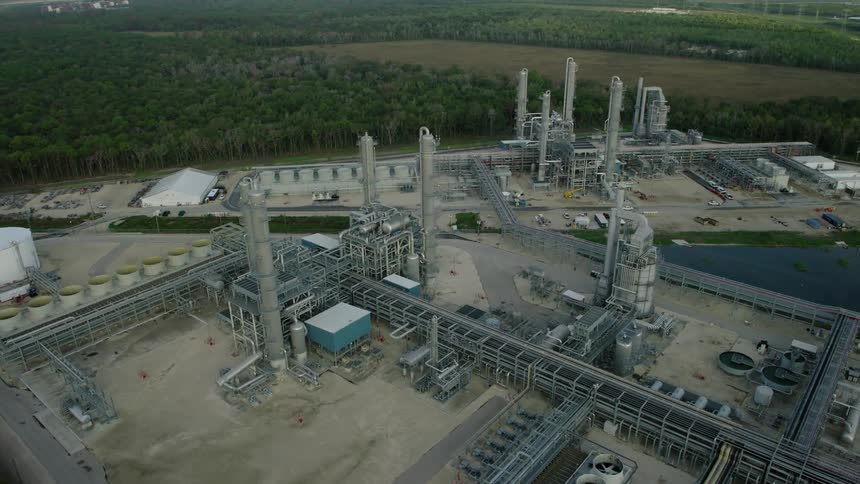 Aerial view of a refinery surrounded by vegetation