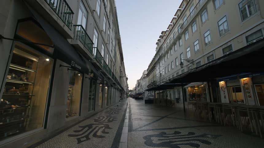 Street in a european city with traditional architecture and cobblestone pavement