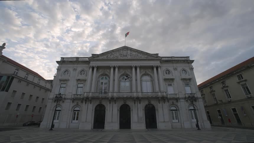 Classical building in a city square on a cloudy day