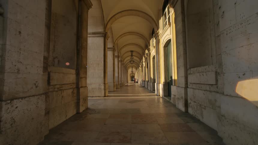 Corridor with a series of stone arches and columns