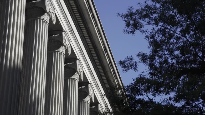 Series of tall classical columns that form part of the facade of a building