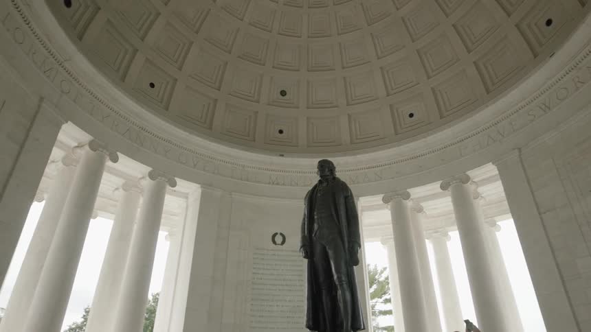Interior of the thomas jefferson memorial in washington dc featuring a bronze statue