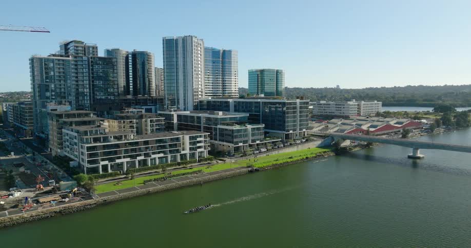 Metropolitan city with skyscrapers on the edge of a greenish lake