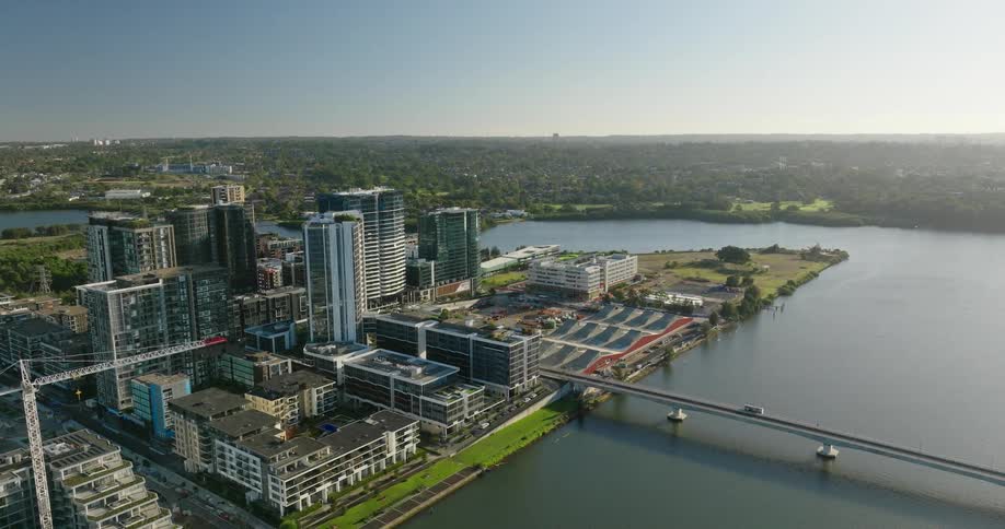 Aerial panorama of a metropolis surrounded by a lake