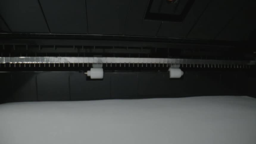 Paper coming out of an office printer