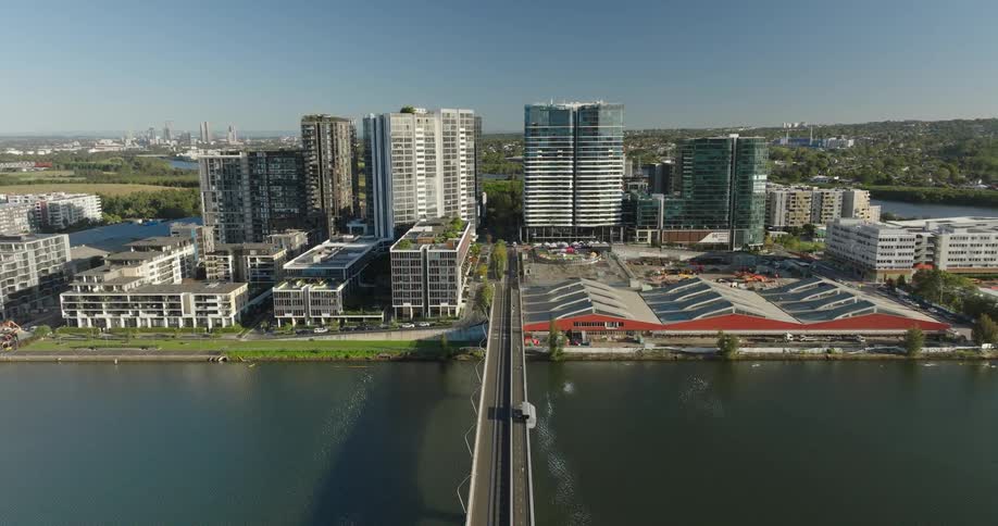 Modern cityscape with tall buildings a bridge over a body of water