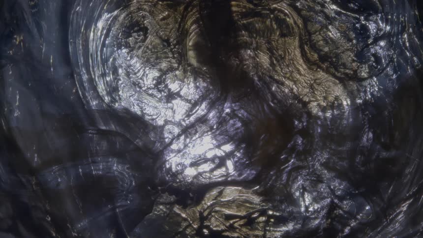 A closeup view of a translucent textured shimmering liquid