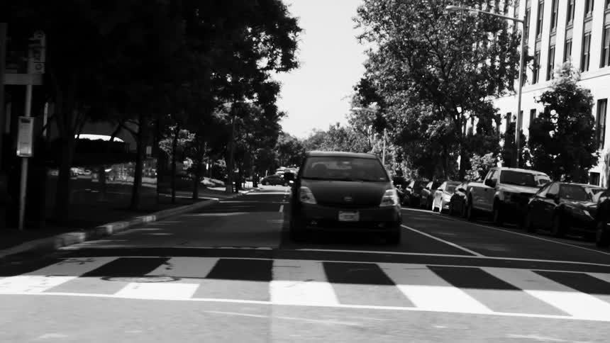 Moving view of a street in a metropolis during the day