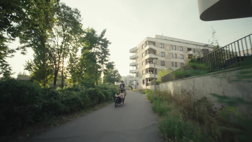 A person is delivering packages by bicycle