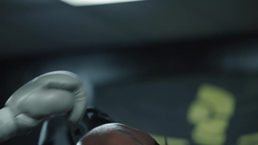 Men fighting inside a boxing ring
