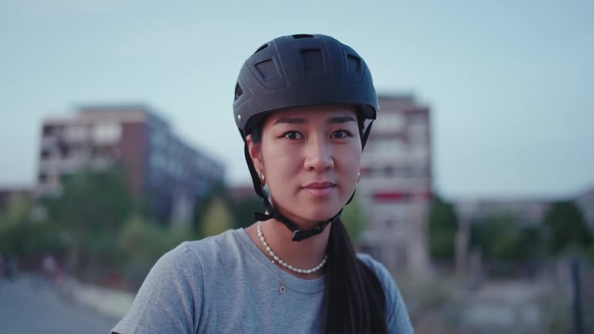 Portrait of a young woman in a black helmet