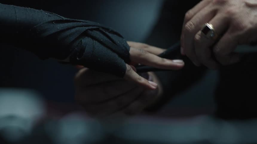 A close up clip of a boxer dressing the hand