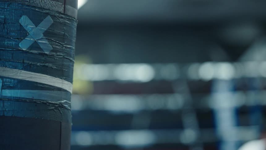 Close up of a moving punching bag inside a gym