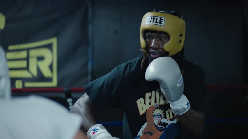 Two men fighting intense boxing