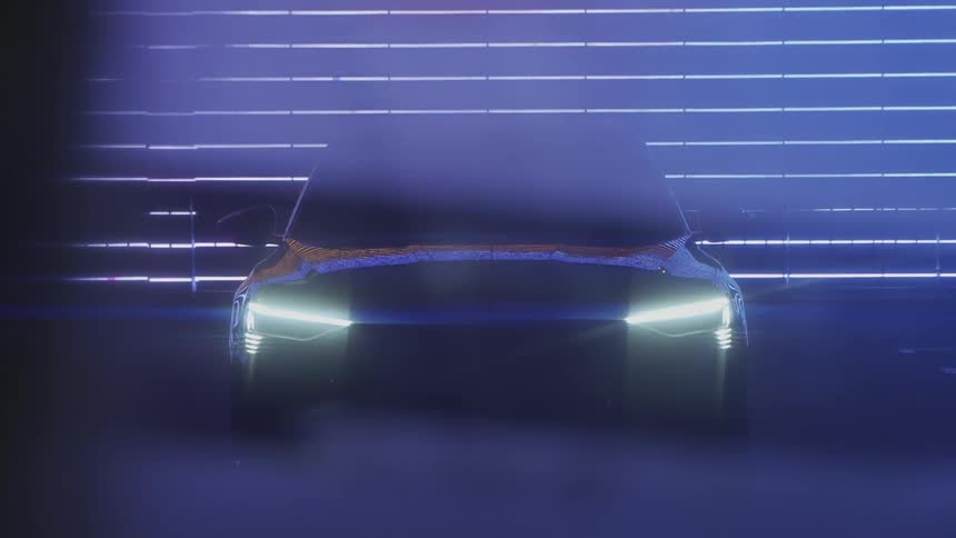 Car in a shed with the headlights on