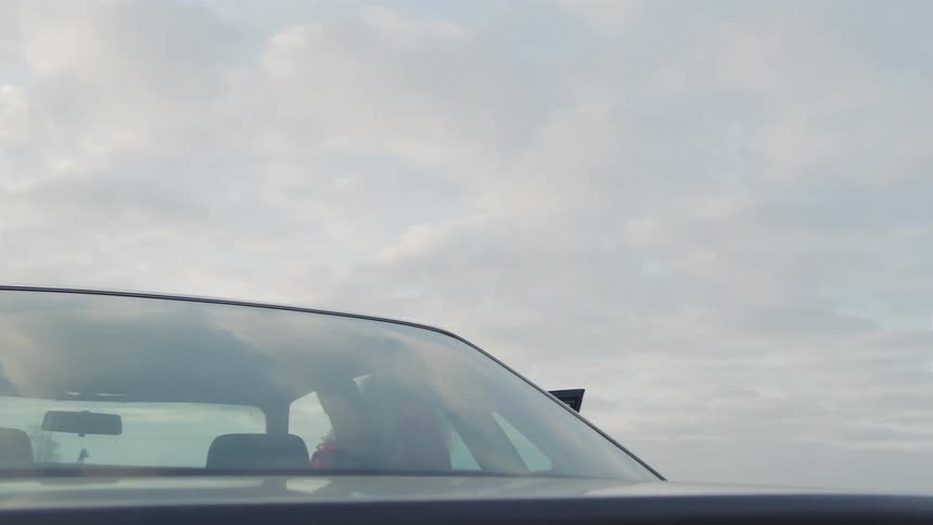 Man and woman getting out of car in a stressed manner