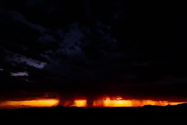 Natural scene of rainy storm and thunder with orange sky