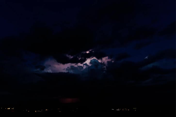 Night sky with dark clouds and thunder