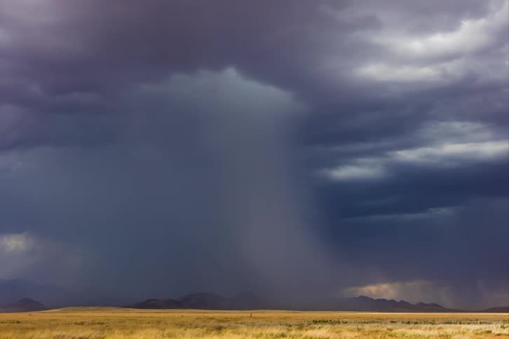 Lightning shoots from the storm clouds