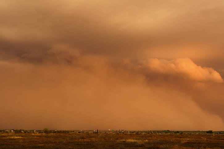 Heavy storm clouds roll over the field