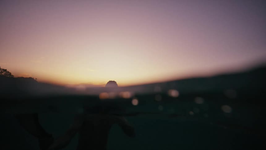 A clip of a person swimming in the river