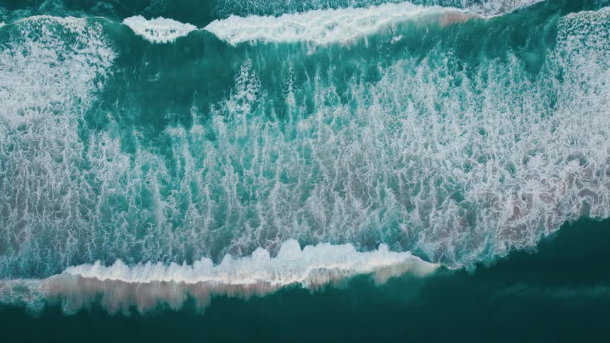 Top view of the sea with foamy waves