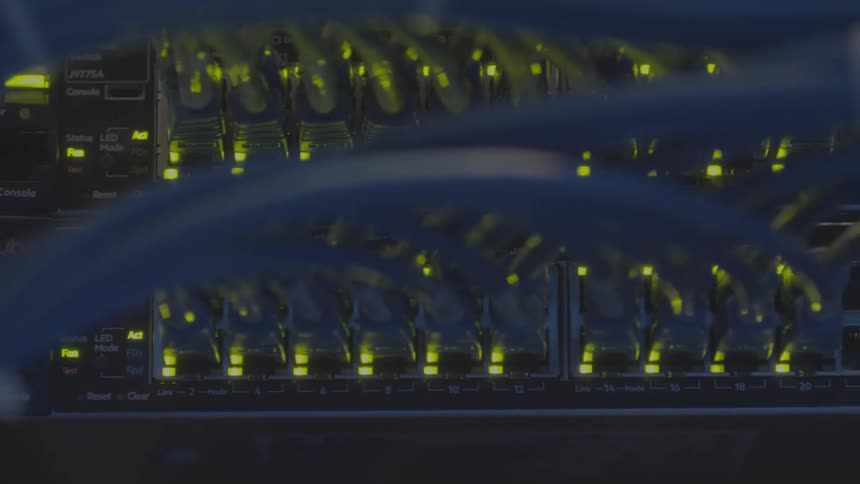 Close up of a server with cables and lights