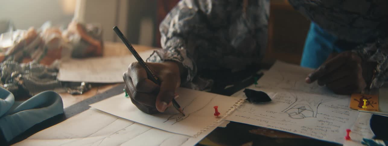 A close up clip of a person sketching