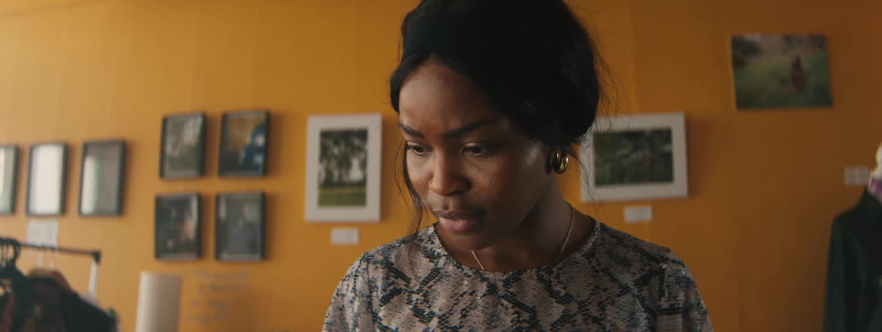 Woman looking down with an expression of concern