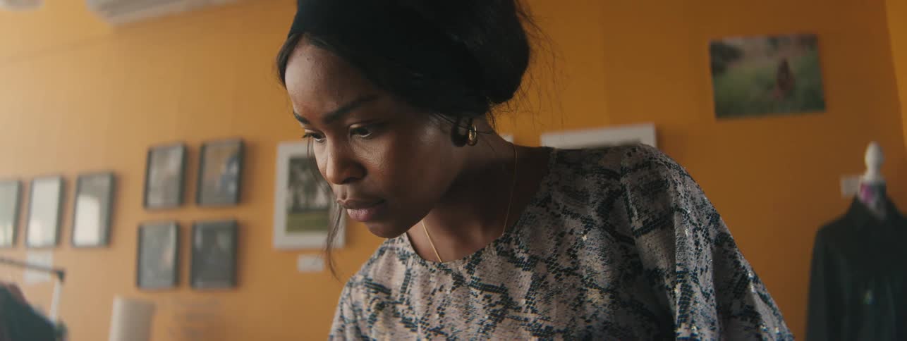 A close up clip of a lady occupied with work