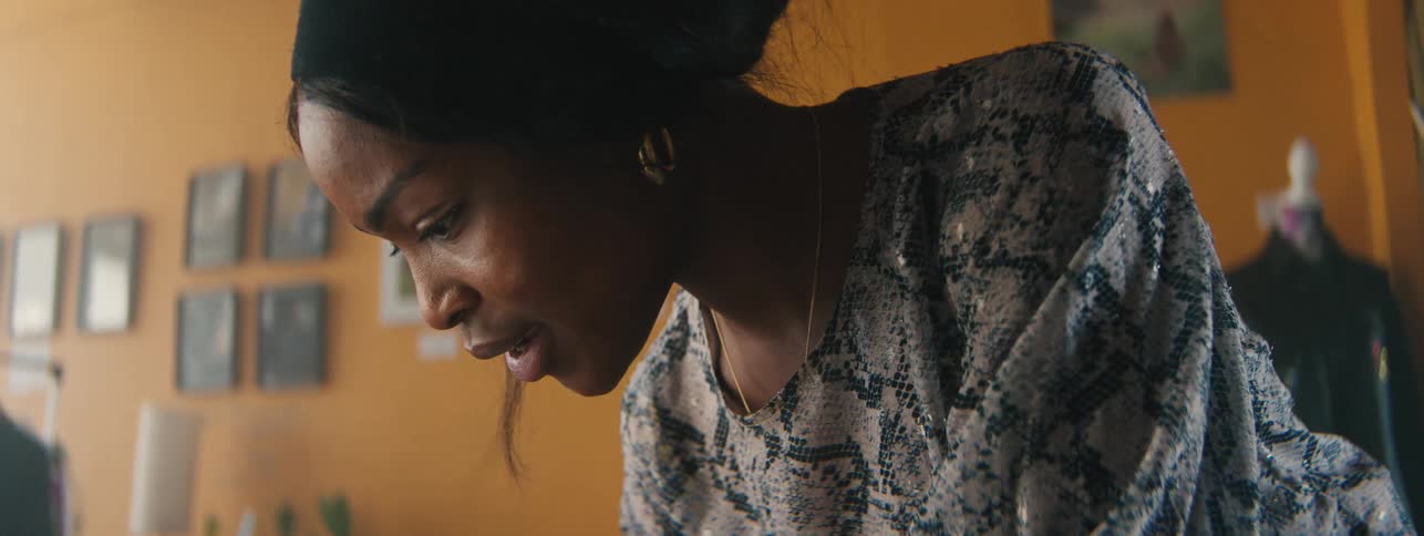 Closeup of a womans face concentrating on a task at a designers studio
