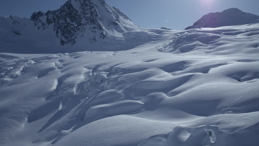 A an aerial winter clip of an arctic mountain